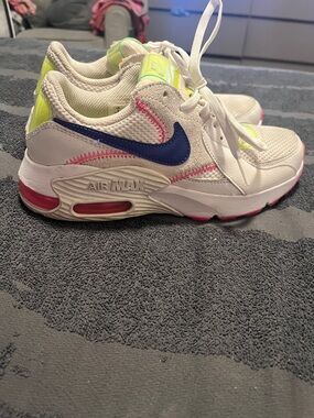 Nike woman White Sneakers with Blue Swoosh and Neon Accents